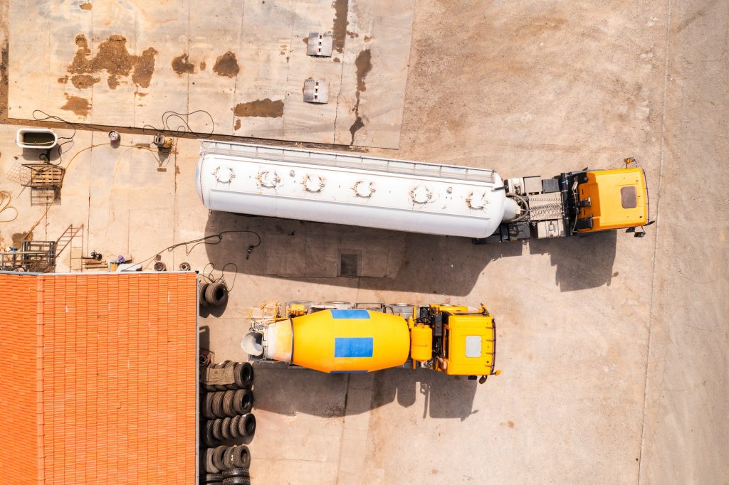 Aerial view of two trucks in maintenance repair shop